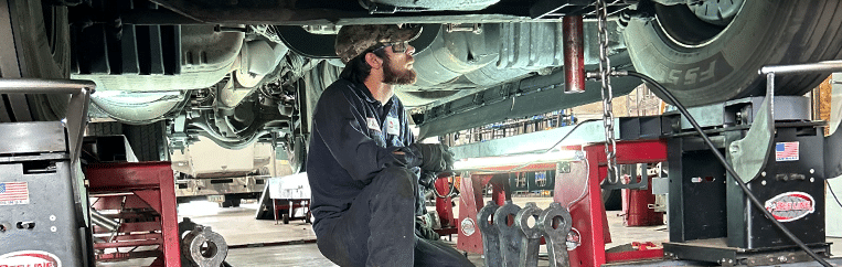 Truck alignment being performed by a technician in Phoenix, AZ.