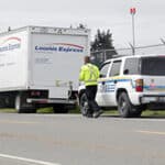 CVSE agent approaches truck for DOT inspection