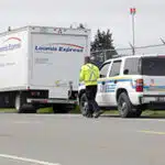 CVSE agent approaches truck for DOT inspection